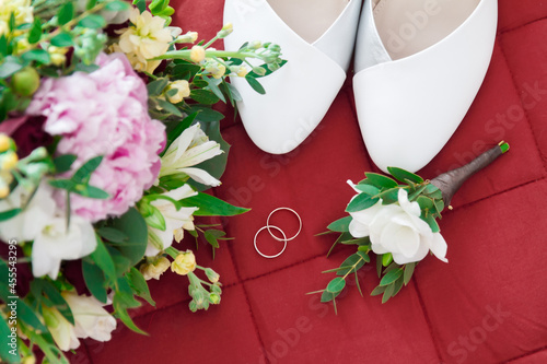 Gold wedding rings and beautiful bouquet.