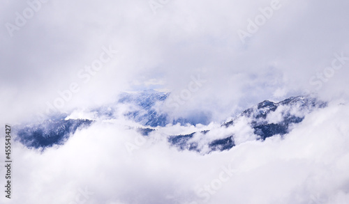 mountains covered with snow on a cloudy day