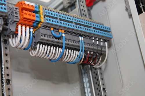 Multi-level pass-through terminals for connecting electrical wires.