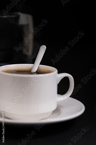 Cup of coffee closeup with spoon