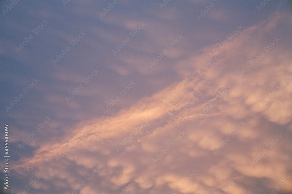 Purple cumulus clouds at sunset