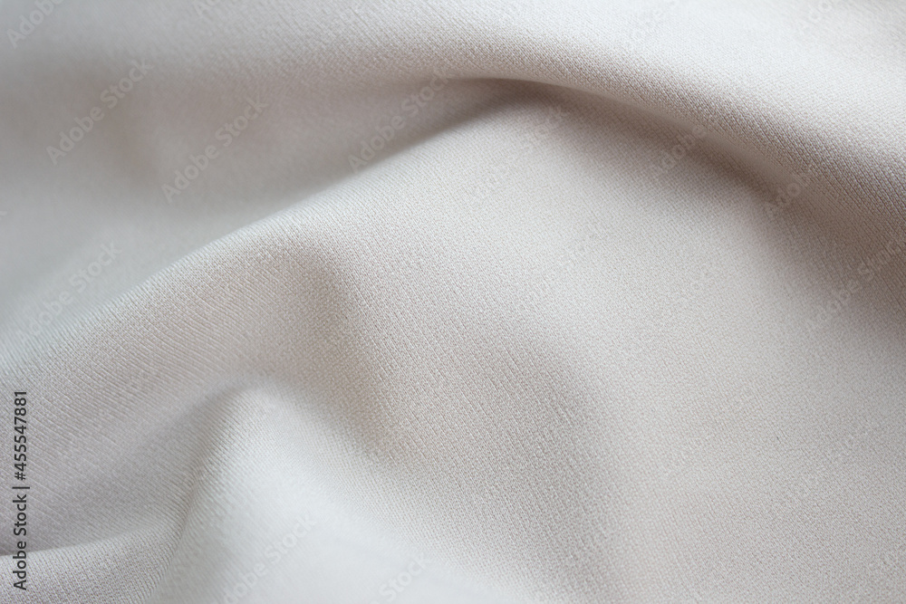 Close-up texture of beige fabric or cloth in beige color. Fabric texture of beige background. crumpled beige fabric
