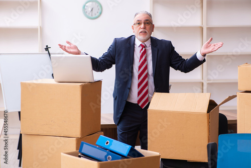 Old businessman employee in relocation concept