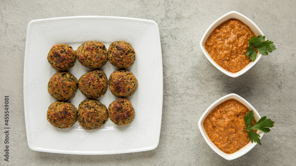 Courgette kofta balls with tomato sauce. Vegan food. Indian cuisine. Courgette kofta balls with tomato sauce. Vegan food. Indian cuisine.