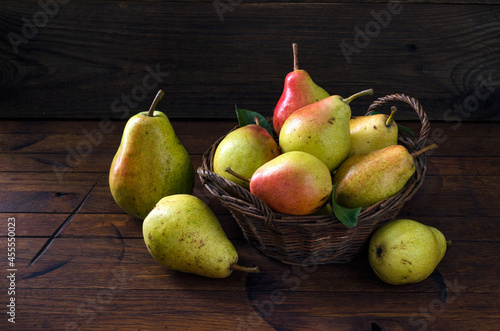 Fresh pears in basket on the table
