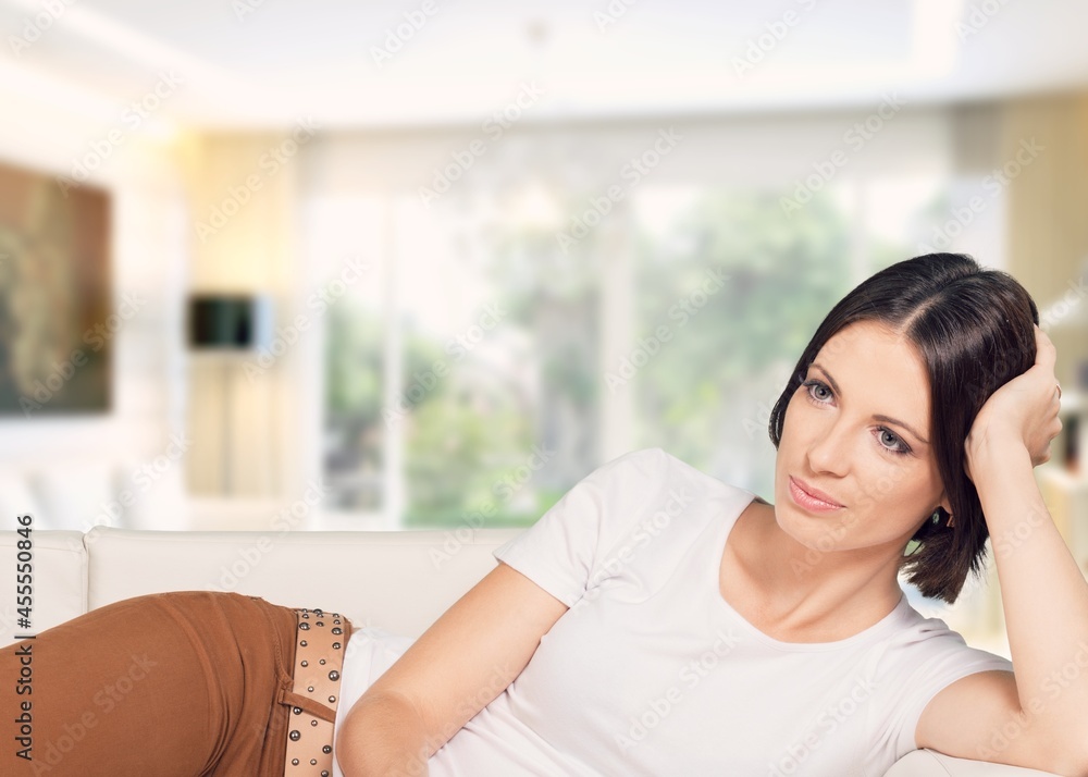 Casual young female on soft comfy couch relax Casual young female on soft comfy couch relax
