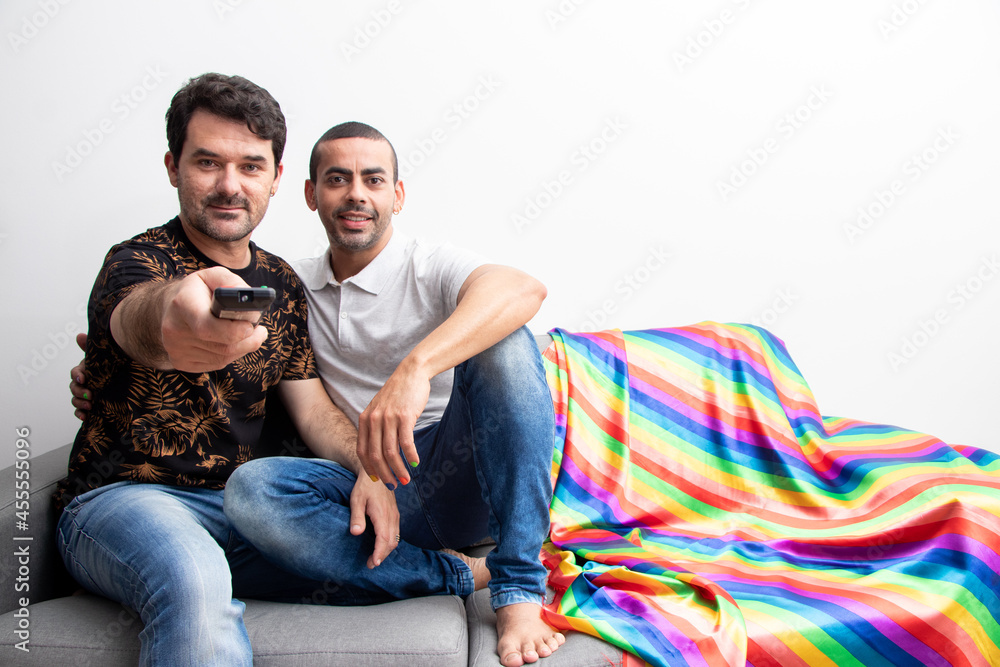 couple sitting in living room watching TV, colored nails, rainbow colors, gay flag
couple sitting in living room watching TV, colored nails, rainbow colors, gay flag