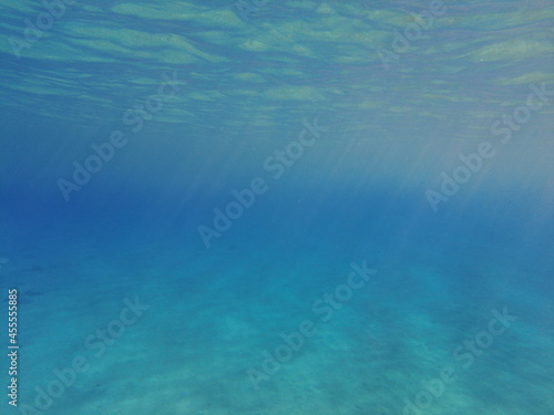 The blue abyss of the Mediterranean Sea. Sun rays under water. Blue water of the earthly sea