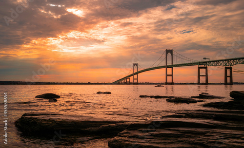 Rising sun and cloudscape over Claiborne Pell Newport Bridge on Route 138 in Rhode Island © Naya Na