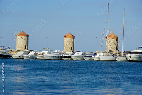 famous windmills at madraki harbor photo