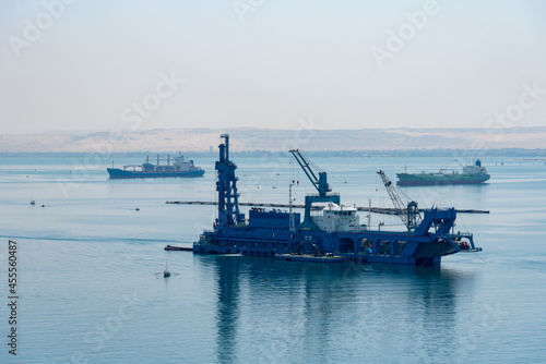Dredger ship sailing through the Great Bitter Lake, Suez Canal. 