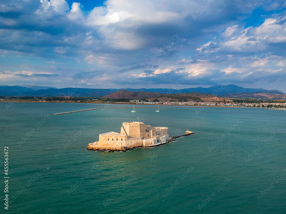 Aerial view over Bourtzi, Venetian water fortress at the entrance of the harbour in Nafplio seaside city in Argolis, Peloponnese, Greece.