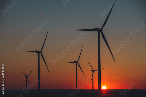 Wind Turbines producing energy at sunset