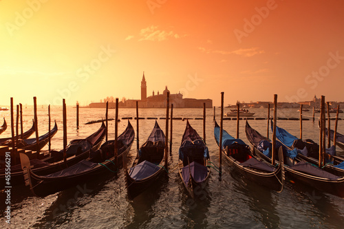 Gondolas in St. Mark's square with Saint George's island at sunrise, Venice, Italy © Massimo Pizzotti