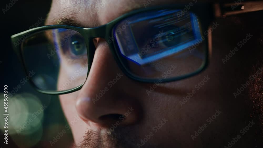 Super Close-up Portrait of Software Engineer Working on Computer, App Reflecting in Glasses. Digital Developer Working on Innovative e-Commerce Application with Machine Learning, AI, Big Data Super Close-up Portrait of Software Engineer Working on Computer, App Reflecting in Glasses. Digital Developer Working on Innovative e-Commerce Application with Machine Learning, AI, Big Data