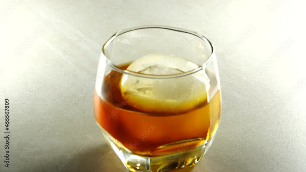 4K On the Rock Cold Brew Iced Coffee In A Clear glass Cup On A granite floor 4K On the Rock Cold Brew Iced Coffee In A Clear glass Cup On A granite floor