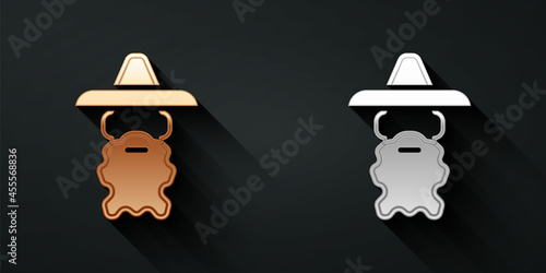 Gold and silver Wizard warlock icon isolated on black background. Long shadow style. Vector
