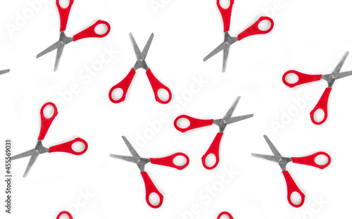 Seamless pattern red scissors on white isolated background