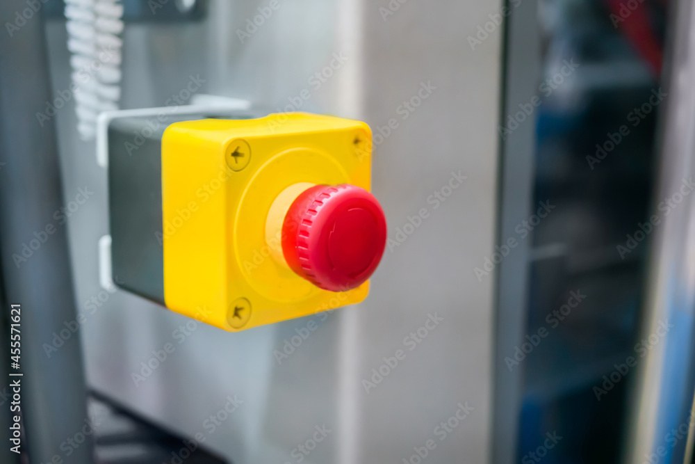 Close up view: machine control panel with power red switch button - emergency stop at factory, plant. Industrial, electronic, technology equipment concept Close up view: machine control panel with power red switch button - emergency stop at factory, plant. Industrial, electronic, technology equipment concept