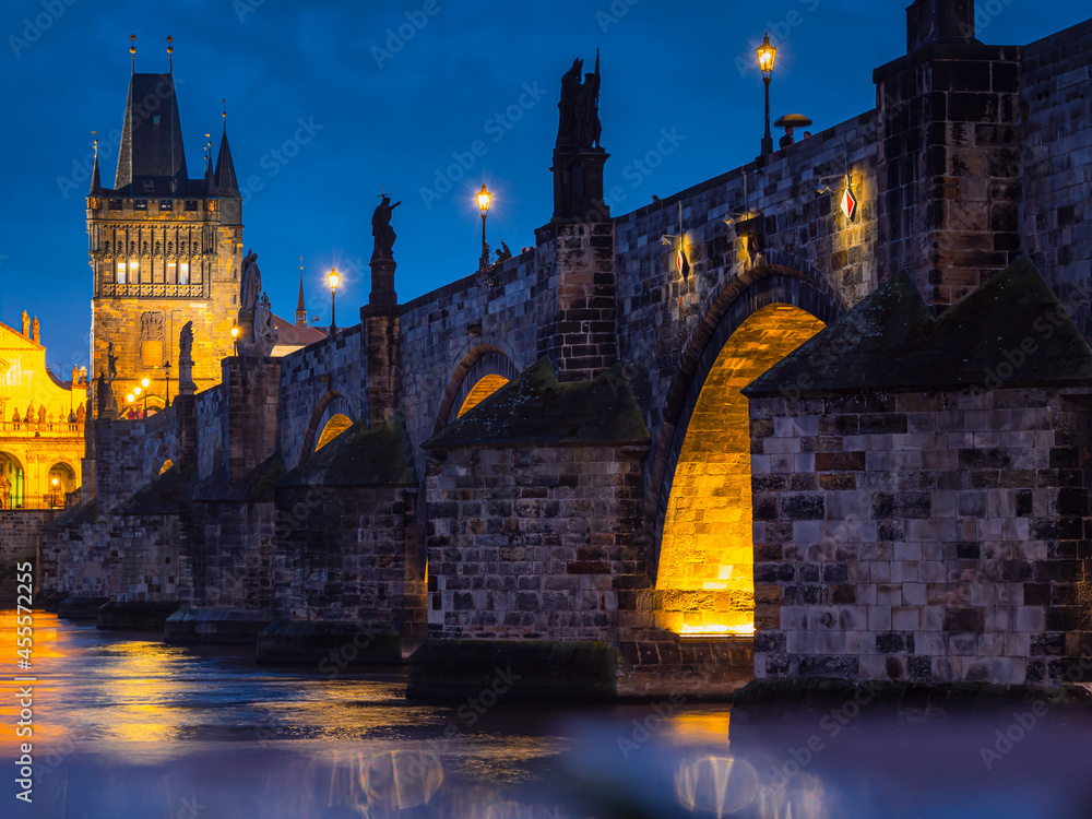 View of Charles Bridge in Prague in the night, Czech Republic. popular tourist attraction. Travel and sights of city breaks. landmarks, travel guide and postcard.
