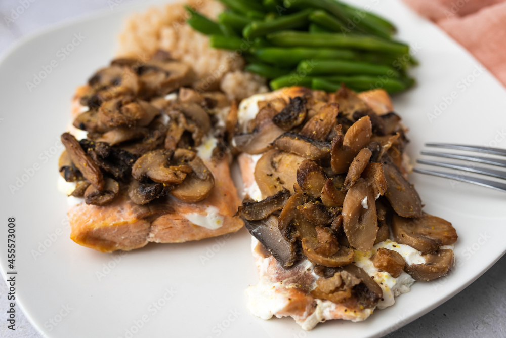 Salmon dinner with brown rice and green beans, topped with plain Greek yogurt and mushrooms. Salmon dinner with brown rice and green beans, topped with plain Greek yogurt and mushrooms.