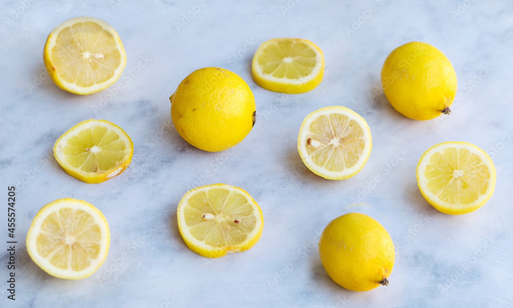 Fresh Lemons on White Marble Background with  Copy Space. Top View.