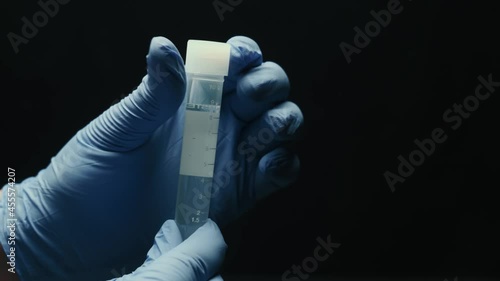Laboratory tubes with blood and virus. Close-up of scientific lab in hospital. Epidemic disease, healthcare, vaccine research and coronavirus 2019-ncov test. High quality 4k footage