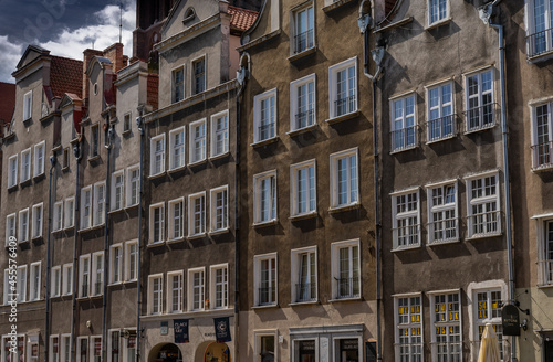 view of many brown house fronts with many windows in the city center of Danzig © makasana photo