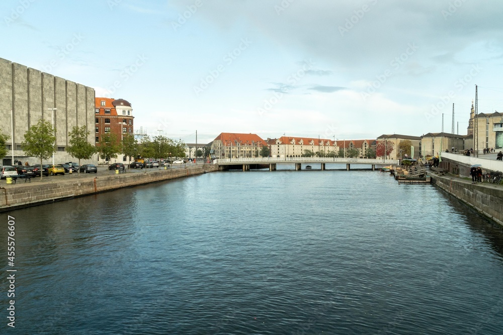 Copenhagen, Denmark. September 27, 2019: Bridge over the canals and architecture of houses and buildings.