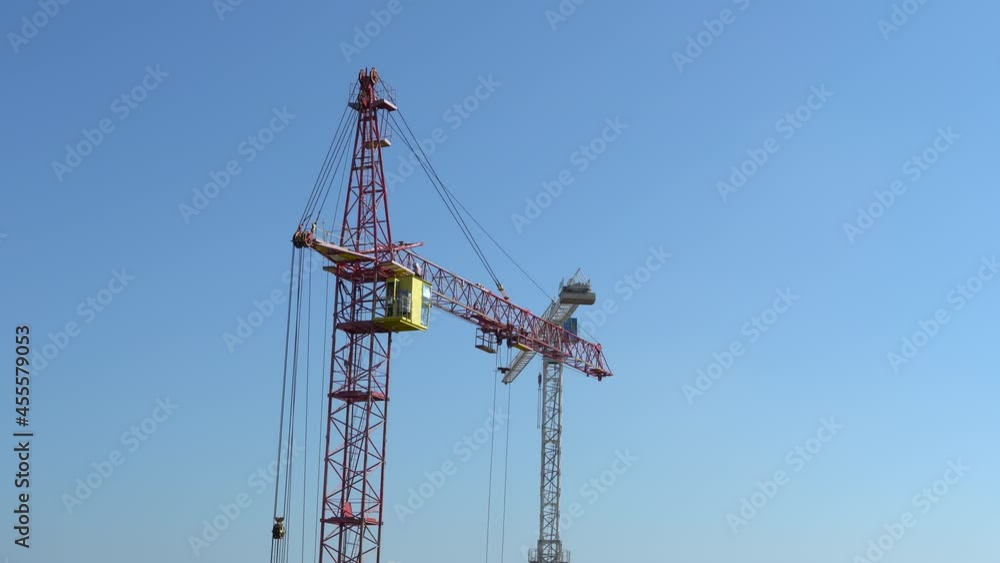 High industrial tower crane at construction site of new residential building. High industrial tower crane at construction site of new residential building.