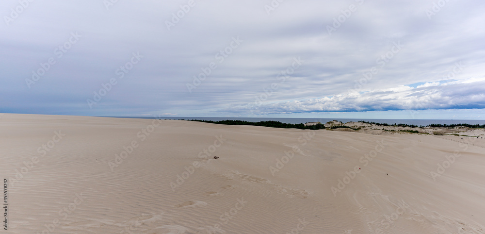 panorama view of endless wandering sand dunes in Slowinski National Park on the Baltic Sea in northern Poland panorama view of endless wandering sand dunes in Slowinski National Park on the Baltic Sea in northern Poland