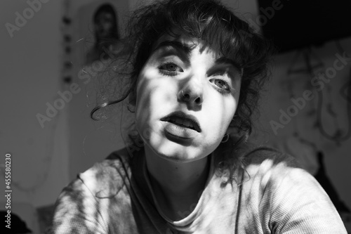 Grayscale portrait of woman indoor