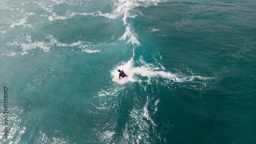 High angle view of person surfing on body of water photo