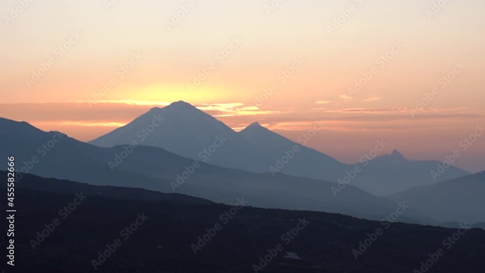 4K video. Sunrise and cloudscape over volcano in Kamchatka in Russia. 4K video. Sunrise and cloudscape over volcano in Kamchatka in Russia.