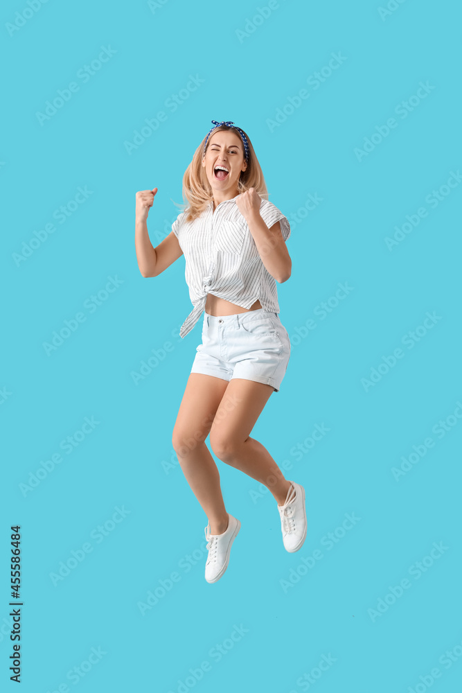Jumping young woman on color background Jumping young woman on color background
