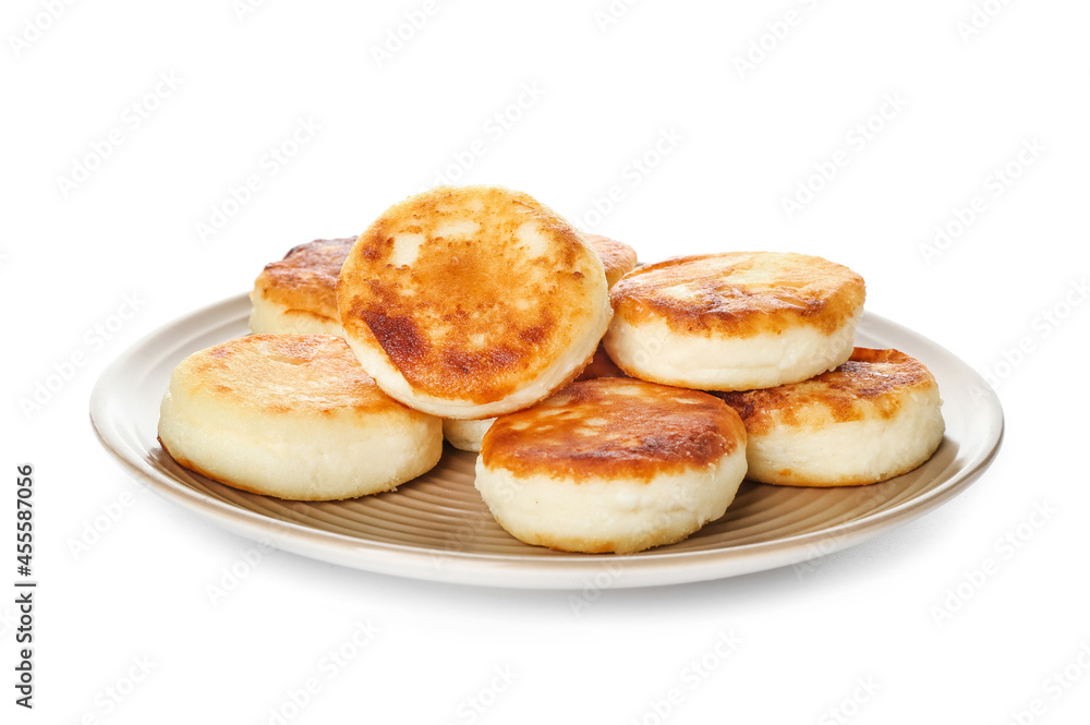 Plate with tasty cottage cheese pancakes on white background