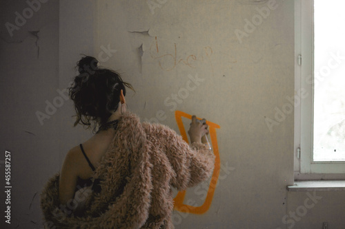 Woman doing graffiti photo