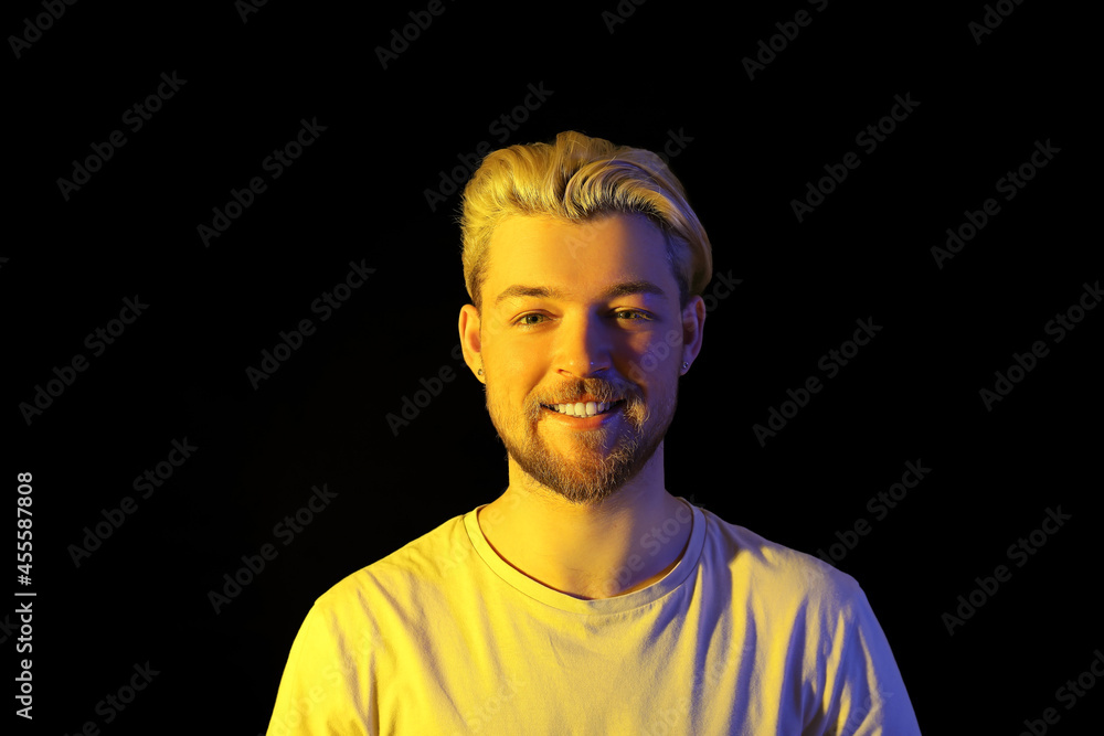 Portrait of handsome young man on dark background Portrait of handsome young man on dark background