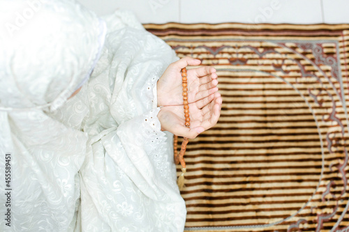 Woman praying on mat photo