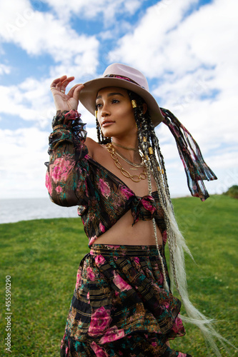 Wallpaper Mural Woman wearing black and pink floral long-sleeved top and skirt with hat Torontodigital.ca