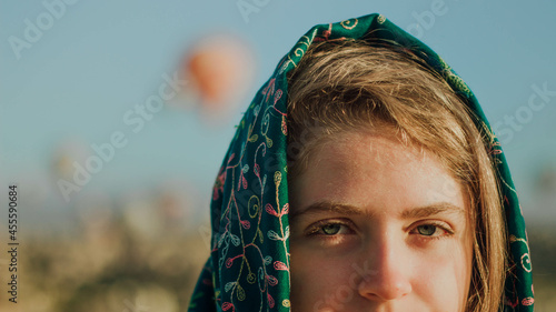 Woman with a headscarf on her head outdoors