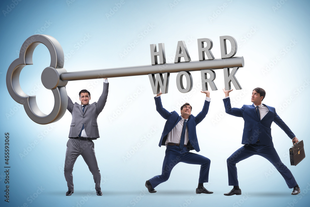 Concept of hard work with key and businessman Concept of hard work with key and businessman
