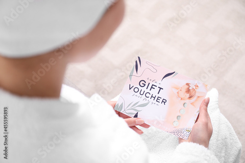 Young woman with gift vouch...