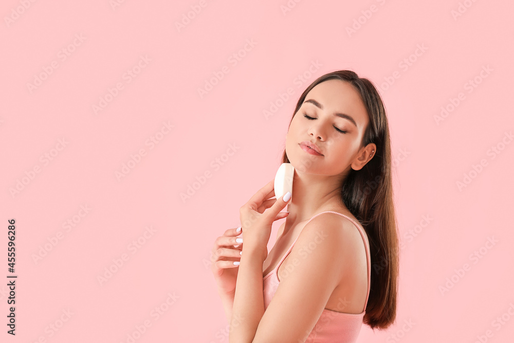 Beautiful young woman with soap on color background Beautiful young woman with soap on color background