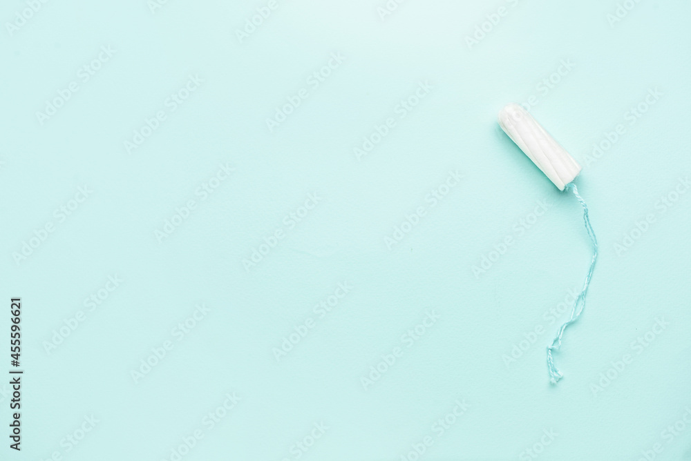 Tampon on color background, top view Tampon on color background, top view