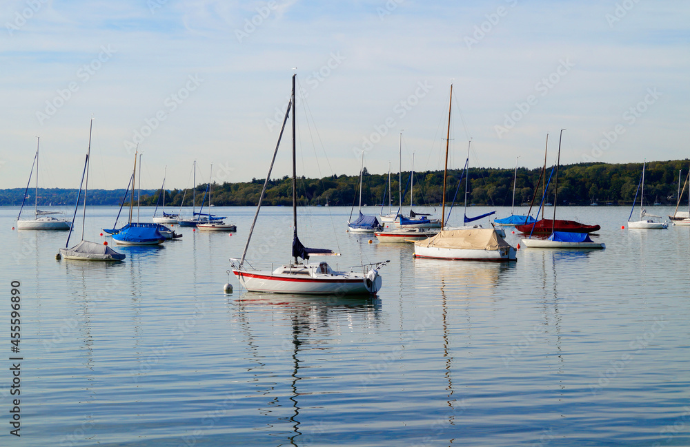 a scenic view of sailing boats in the evening sun on lake Ammersee in Germany	