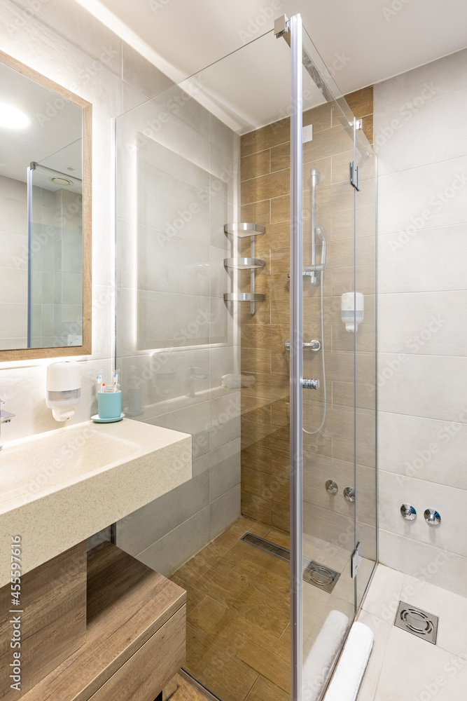 Interior of a hotel bathroom with a shower cabin Interior of a hotel bathroom with a shower cabin