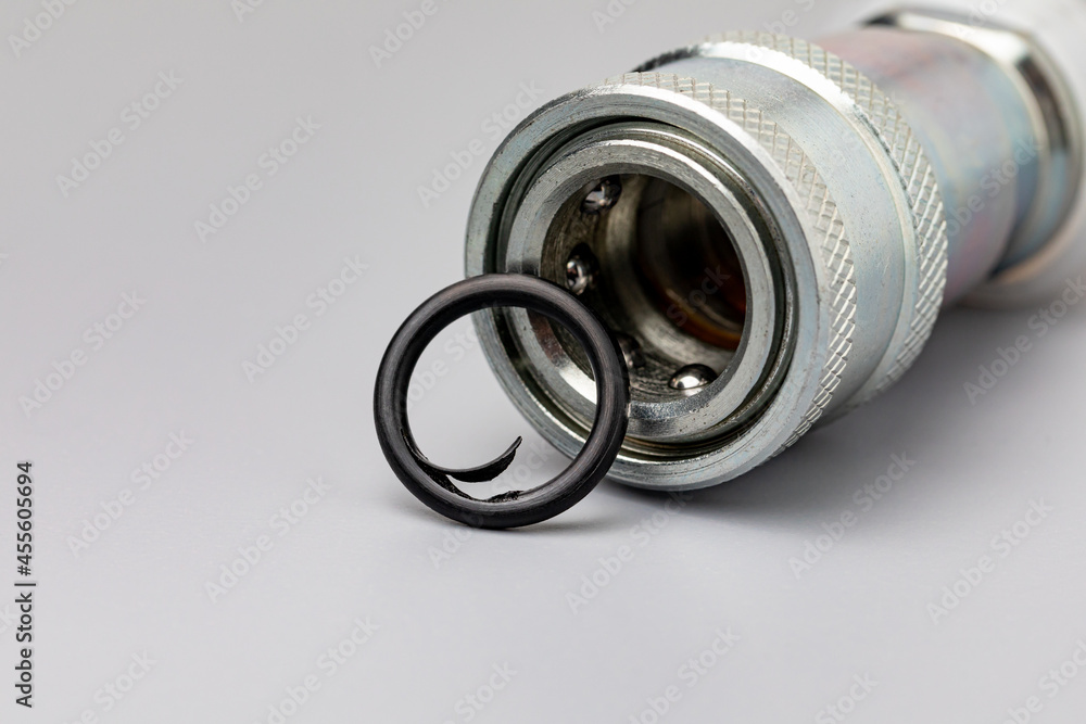 Hydraulic coupler with O-ring seal damage. lawn and farming equipment maintenance, repair and service concept Hydraulic coupler with O-ring seal damage. lawn and farming equipment maintenance, repair and service concept