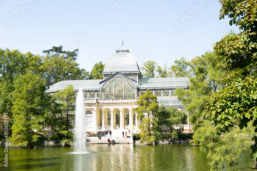Crystal Palace and lake seen from afar in Retiro, Madrid