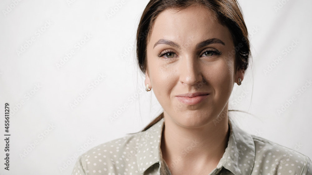 Portrait of smiling woman on white background. Close-up Portrait of smiling woman on white background. Close-up